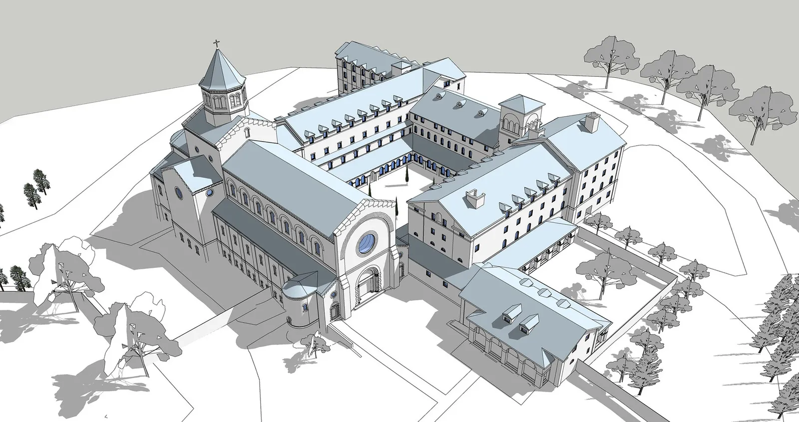 Aerial view of the massing model of the full abbey: church, cloister and wings set among trees.