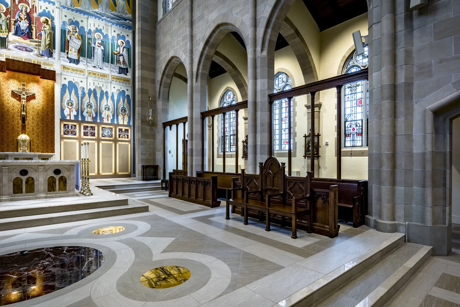 The sanctuary from the side: the inlaid marble floor with its roundels, the altar rail and the steps to the altar.