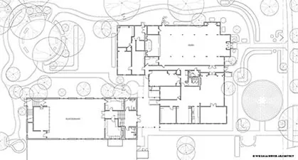Site plan drawing of church buildings among trees with surrounding walks and drives