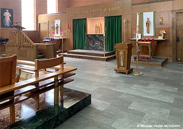 Sanctuary with green curtained apse, brick walls, and the inscription Into Thy Hands O Lord